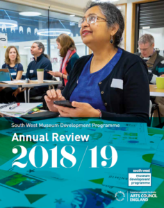 Annual Review Front Cover - A training delegate smiles as she learns about animation