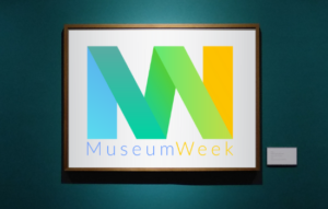 The Museum Week logo in a frame on a wall.